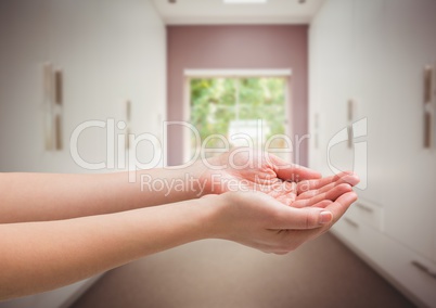 Hands cupped in room