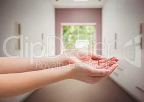 Hands cupped in room