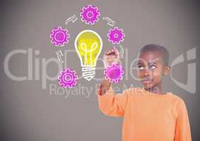 Boy writing in front of brown blank background with idea light bulb and settings graphics