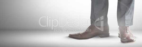 Businessman's feet and shoes with grey background