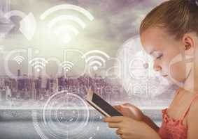 Girl Holding tablet and City with wifi icons