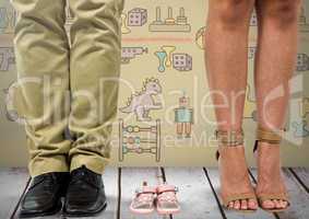 Father and mother's legs with child's shoes sandals with toys graphics