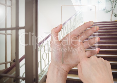 Hand Touching Glass Screen on stairs