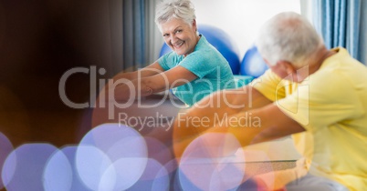 Senior people exercising in gym