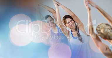 Man and women performing yoga