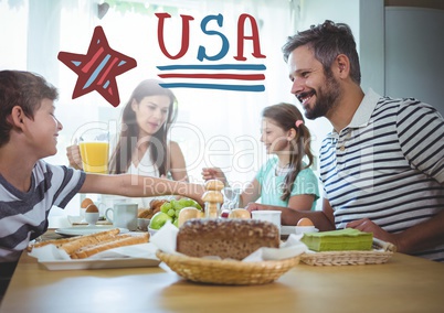 American family sitting around a table for 4th of July dinner