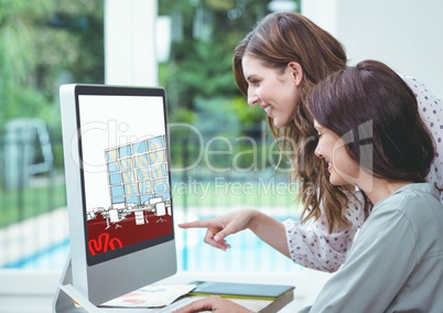 two young businesswomen working on the design of the new office on the computer