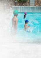Children jumping into Swimming pool with transition