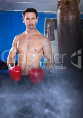 Boxer fighter man with transition and punch bag