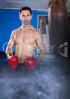 Boxer fighter man with transition and punch bag