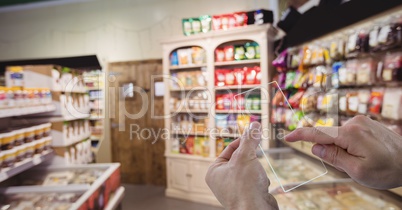 Hands taking picture with transparent device in grocery store