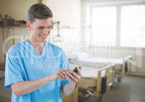 Doctor on mobile phone in hospital room