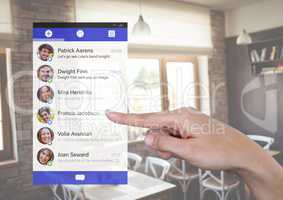 Hand touching Social Media App Interface in cafe