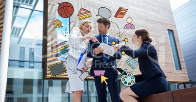 Digital composite image of various icons with businessman discussing in background