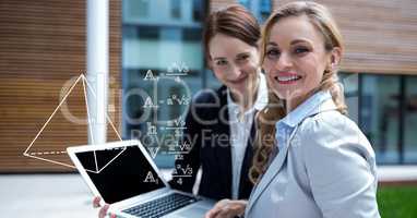 Digital composite image of businesswomen planning strategies on laptop