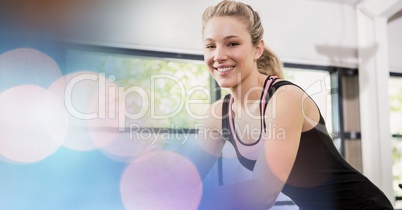 Happy woman exercising in gym