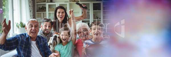 Family laughing on couch with blurry purple transition