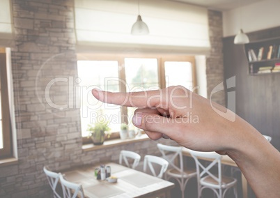 Hand pointing in air in cafe