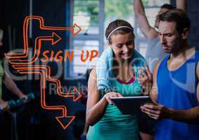 Orange sign up text next to man and woman and tablet in gym