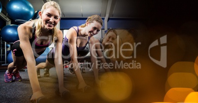 Confident women exercising in gym