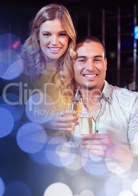 Couple having fun celebration party with  sparkling lights bokeh transition