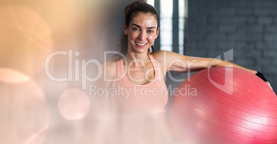 Woman with yoga ball and peach bokeh transition