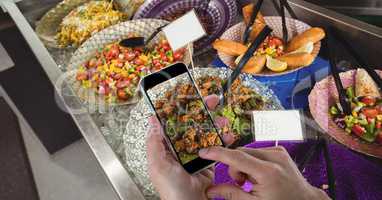 Hands taking picture of food with mobile phone at grocery store