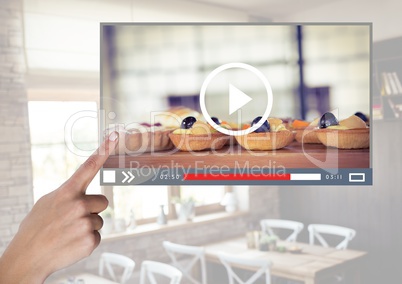 Hand touching Cafe Baking cakes video player App Interface