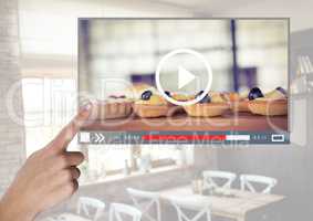Hand touching Cafe Baking cakes video player App Interface