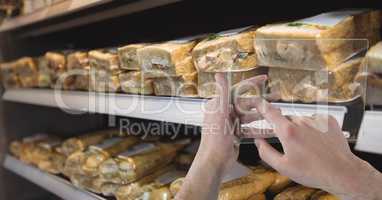 Hands photographing sandwiches through transparent device