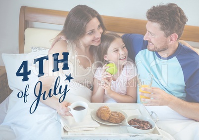 family chilling on the bed for the 4th of July