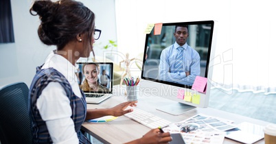 Businesswoman video conferencing on computer in office