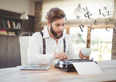 Hipster man  on typewriter in warm bright room with letters