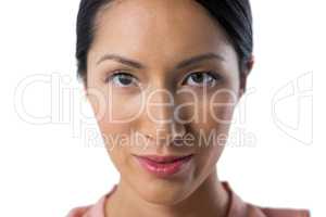 Confident female executive against white background