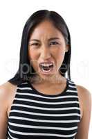 Depressed woman standing against white background