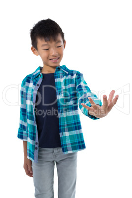 Boy pretending to hold invisible object