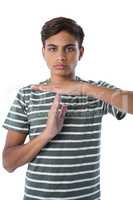 Boy making a timeout hand gesture