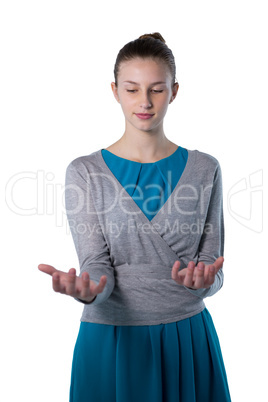 Teenage girl pretending to hold invisible object
