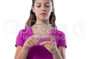 Teenage girl using glass digital tablet