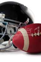 Close up of American football with sports helmet