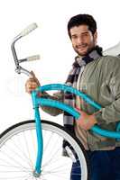 Portrait of smiling man carrying a bicycle