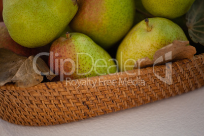 Close-up of pears in wicker basket