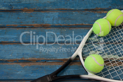 High angle view of tennis racket and balls