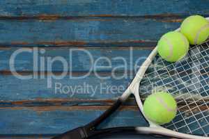 High angle view of tennis racket and balls