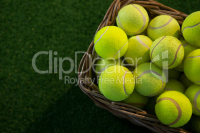 Overhead view of tennis balls in wicker basket