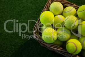 Overhead view of tennis balls in wicker basket