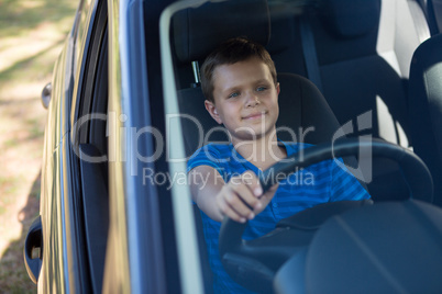 Teenage boy driving a car