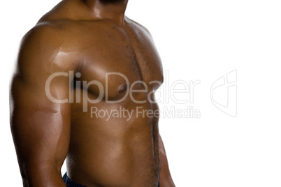 Mid section of shirtless muscular player