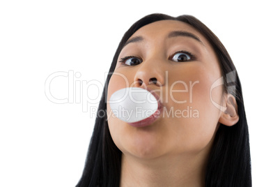 Woman blowing bubble gum