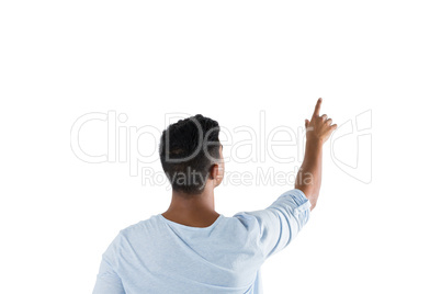 Man pretending to touch an invisible screen against white background